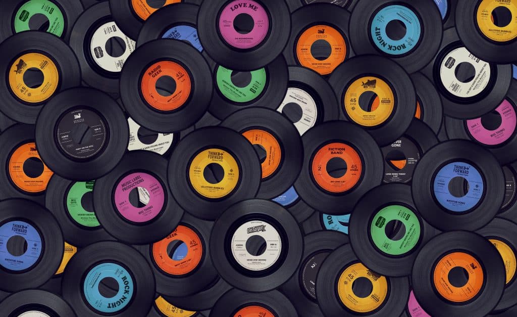 pile of vinyl records colorful labels retro music