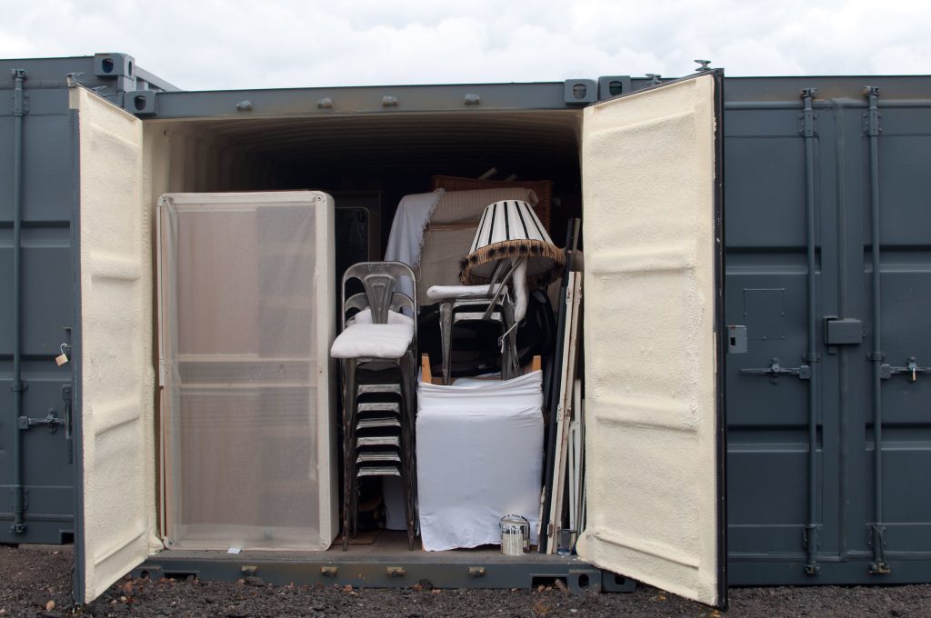 shipping container self storage unit full of household goods