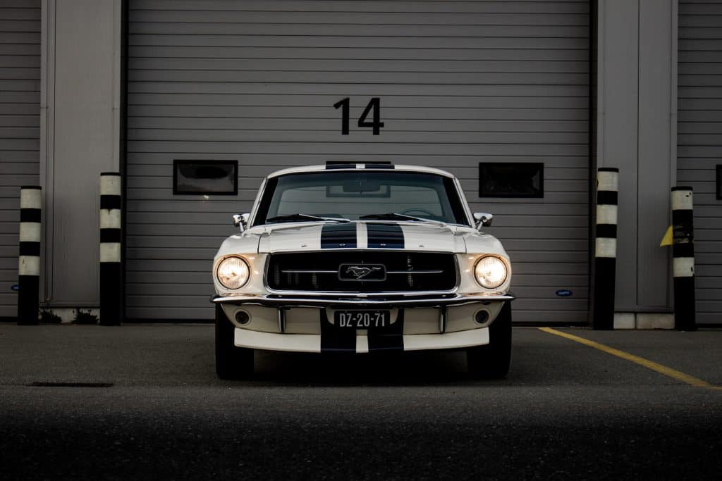 mustang in front of garage warehouse storage door