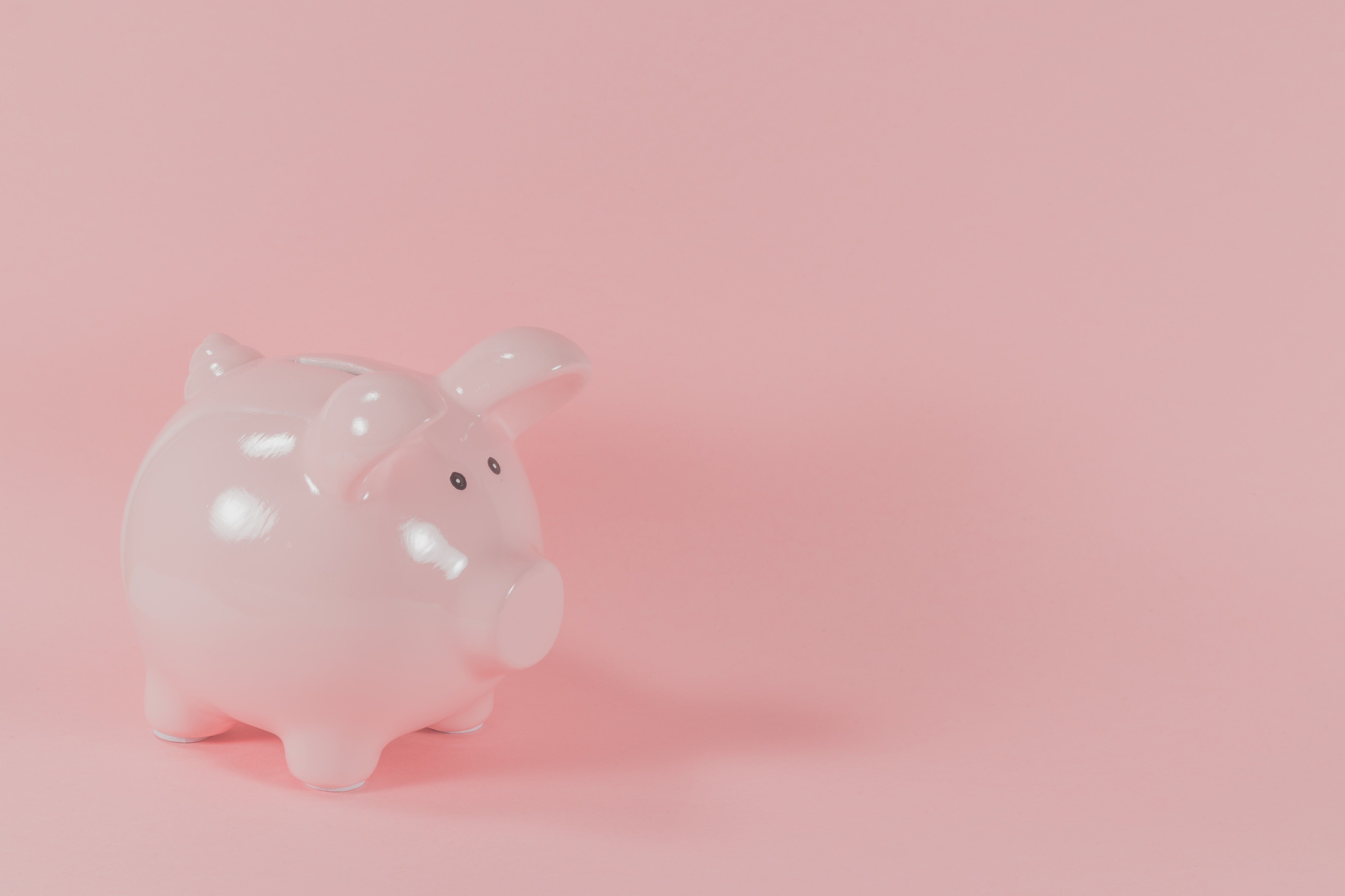 piggy bank against pink background getting the best deal