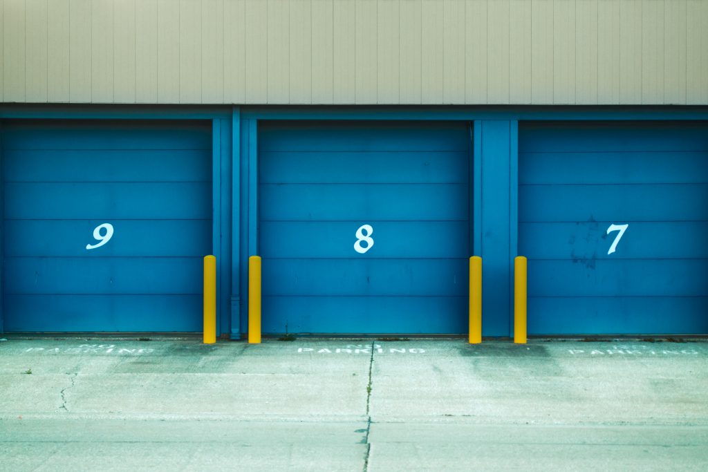 blue storage unit doors with numbers self storage facility