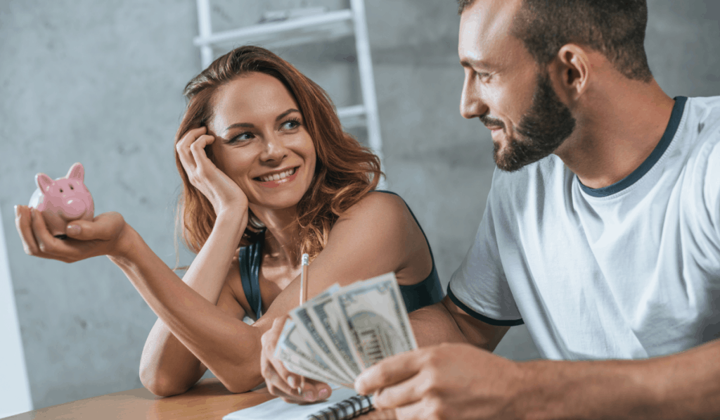 happy couple planning new apartment budget