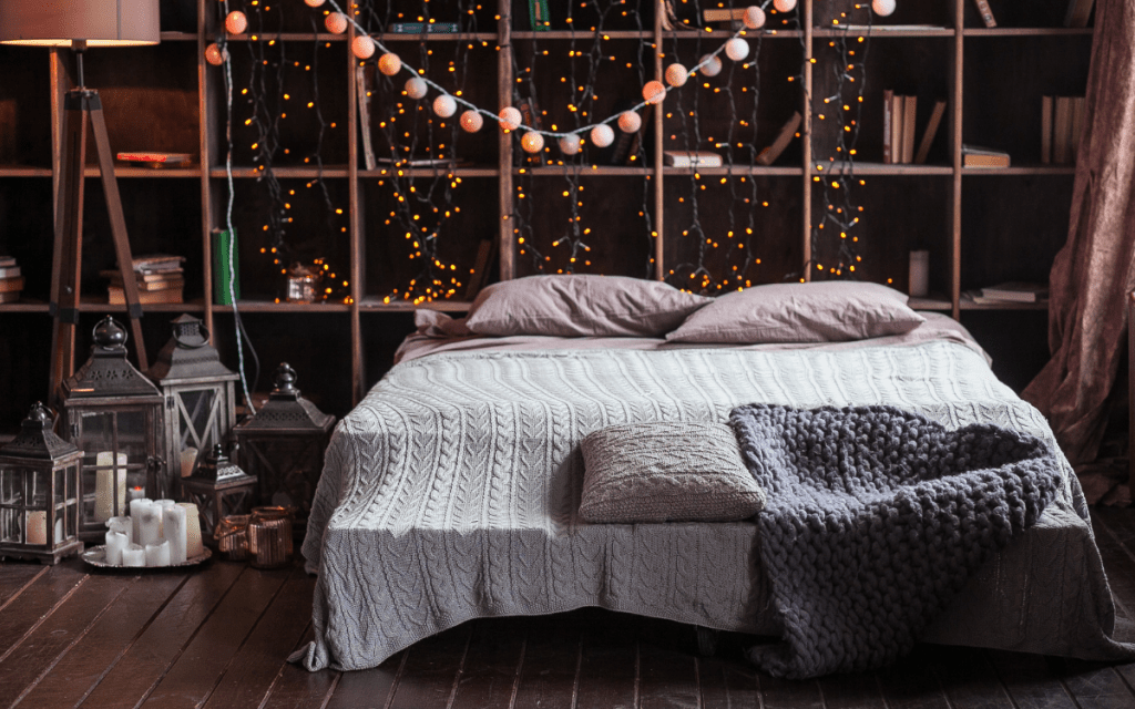 cozy bed with string lights