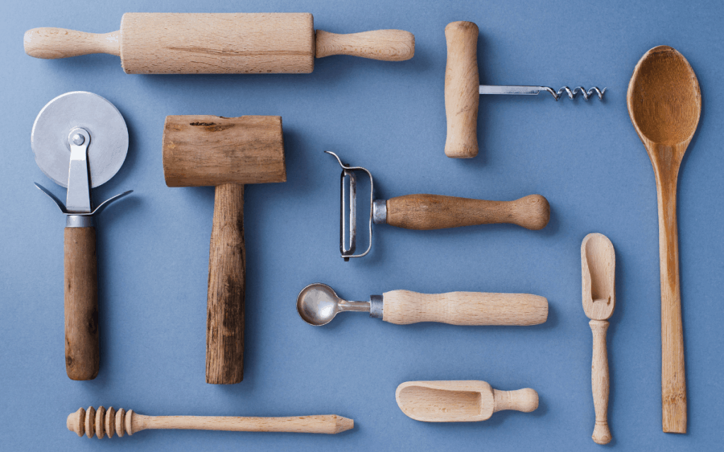 kitchen utensils flatlay on blue background
