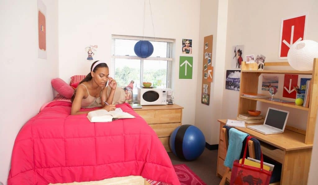 single bed with simple bedding in the school dormitory